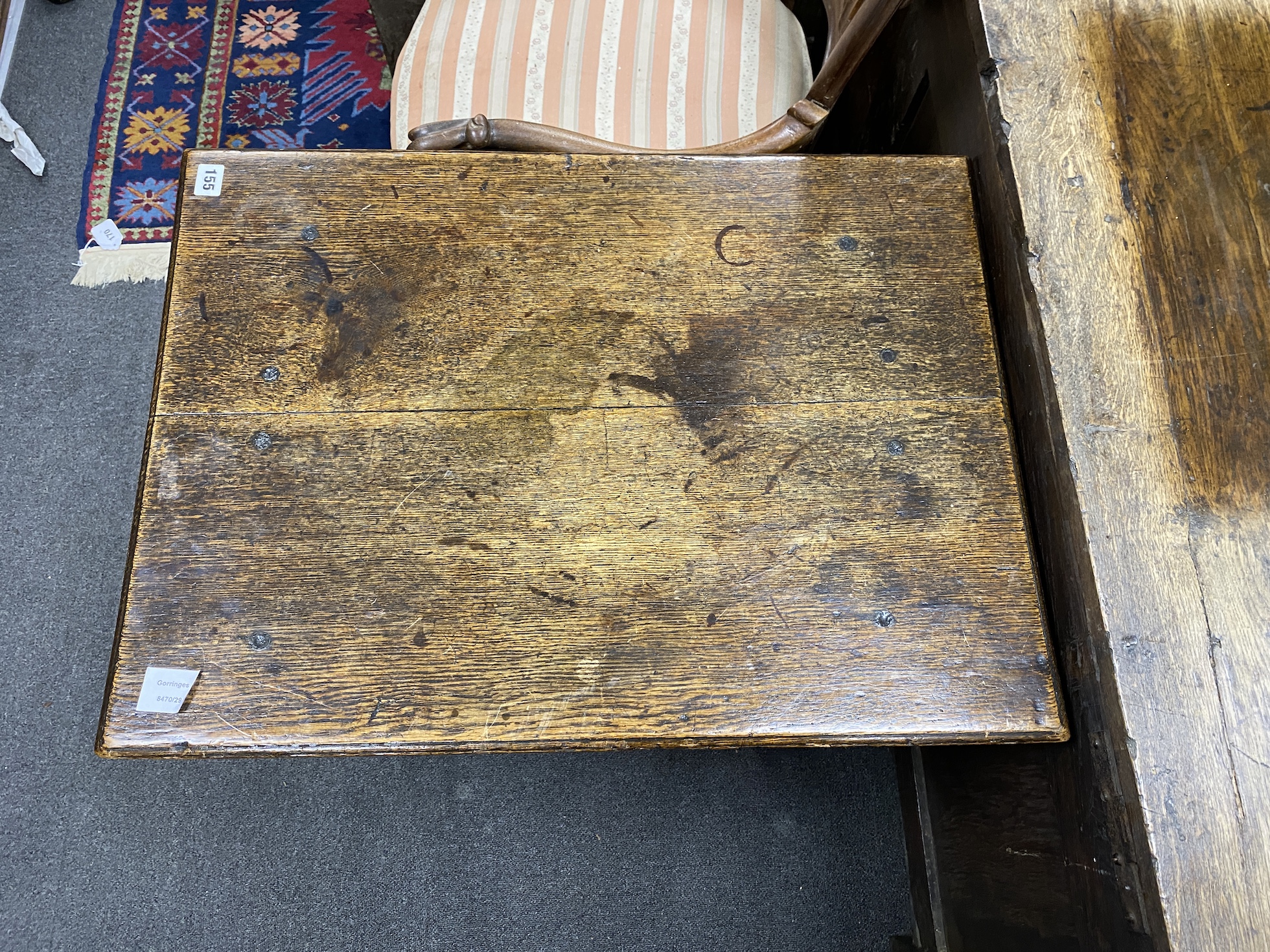 A late 17th century William and Mary small rectangular oak centre table, with arched apron, on square and baluster turned legs, joined by H-stretcher, width 72cm, depth 53cm, height 69cm